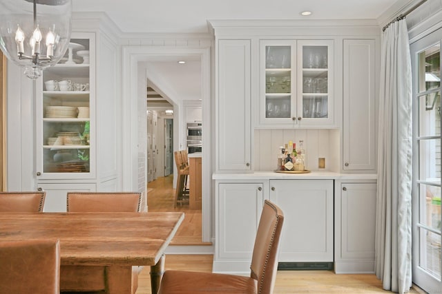 4 Budner Ln, Westport, CT 06880 - dining area with a chandelier and light wood-type flooring