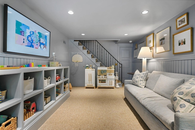4 Budner Ln, Westport, CT 06880 - carpeted living area with stairs, recessed lighting, a decorative wall, and wainscoting