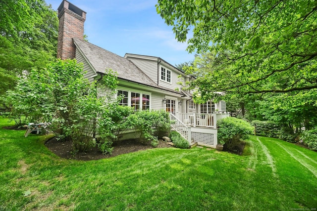 4 Budner Ln, Westport, CT 06880 - back of property with a yard, a deck, and a chimney