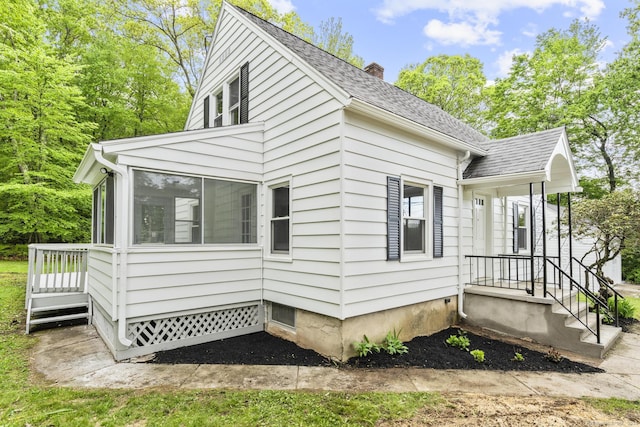 291 Maple Hill Rd, Naugatuck, CT 06770 - view of side of home with a chimney, a sunroom, and a shingled roof
