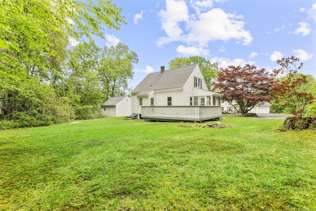 291 Maple Hill Rd, Naugatuck, CT 06770 - rear view of property with a yard, a chimney, and a wooden deck