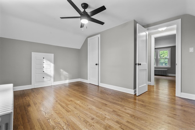 291 Maple Hill Rd, Naugatuck, CT 06770 - additional living space featuring radiator heating unit, vaulted ceiling, a ceiling fan, wood finished floors, and baseboards
