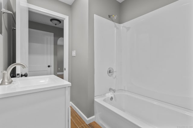 291 Maple Hill Rd, Naugatuck, CT 06770 - full bath featuring shower / bath combination, baseboards, wood finished floors, and vanity