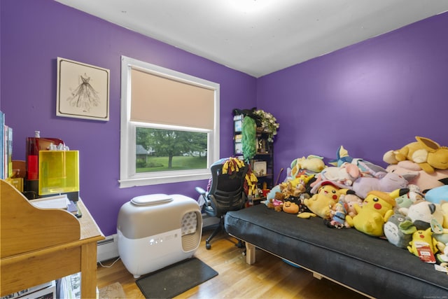 21 Cadwell Rd, Bloomfield, CT 06002 - bedroom featuring wood finished floors and a baseboard heating unit
