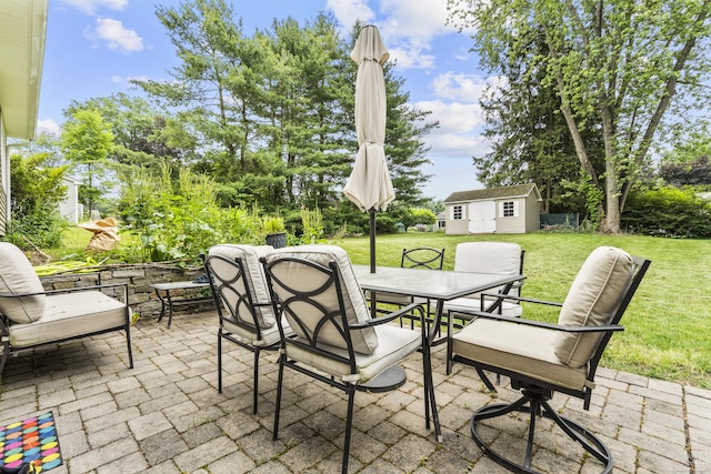 21 Cadwell Rd, Bloomfield, CT 06002 - view of patio featuring outdoor dining space and an outbuilding