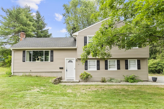 21 Cadwell Rd, Bloomfield, CT 06002 - split level home with a front yard, a chimney, and a shingled roof