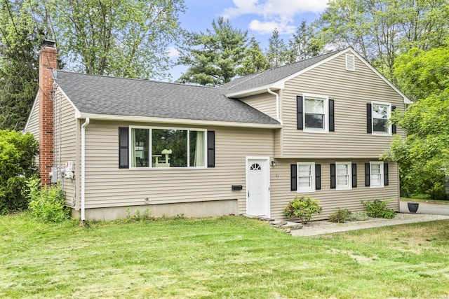 21 Cadwell Rd, Bloomfield, CT 06002 - split level home featuring roof with shingles, a chimney, and a front yard