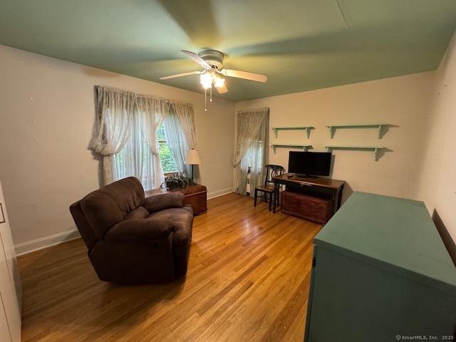 48 Bailey St, Trumbull, CT 06611 - living area with light wood-style flooring, ceiling fan, and baseboards