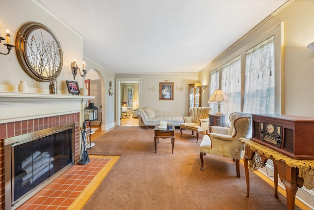8 Usher Ave, Plainville, CT 06062 - carpeted living room featuring ornamental molding, arched walkways, and a brick fireplace