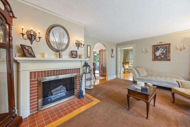 8 Usher Ave, Plainville, CT 06062 - carpeted living area featuring arched walkways, a brick fireplace, and crown molding