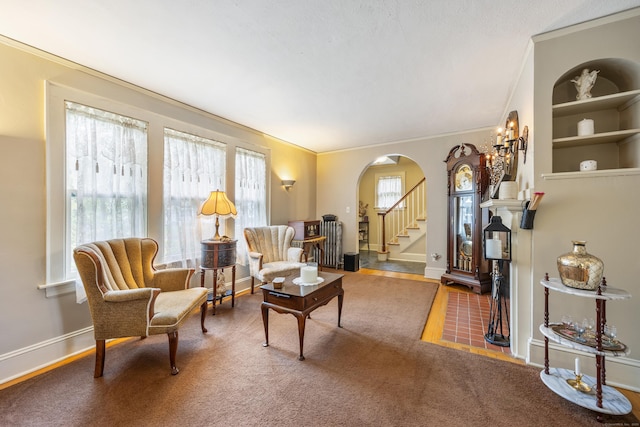 8 Usher Ave, Plainville, CT 06062 - living area featuring arched walkways, ornamental molding, baseboards, and stairs