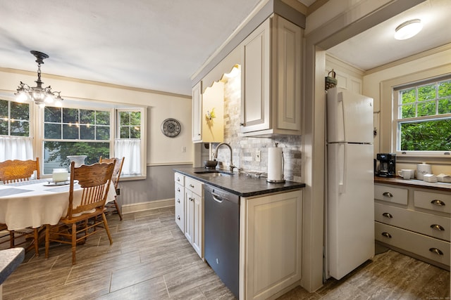 8 Usher Ave, Plainville, CT 06062 - kitchen featuring freestanding refrigerator, dishwasher, a sink, tasteful backsplash, and pendant lighting