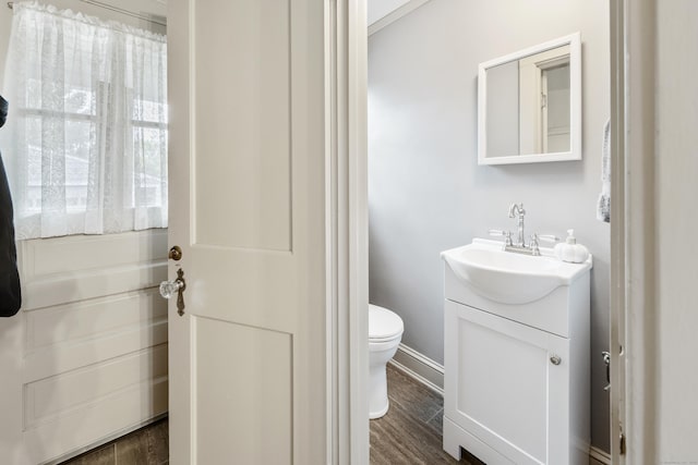 8 Usher Ave, Plainville, CT 06062 - bathroom with vanity, toilet, and wood finished floors