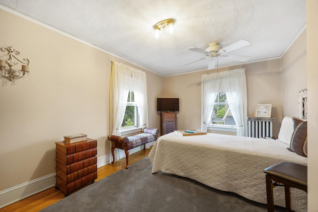 8 Usher Ave, Plainville, CT 06062 - bedroom with multiple windows, ornamental molding, wood finished floors, baseboards, and a textured ceiling