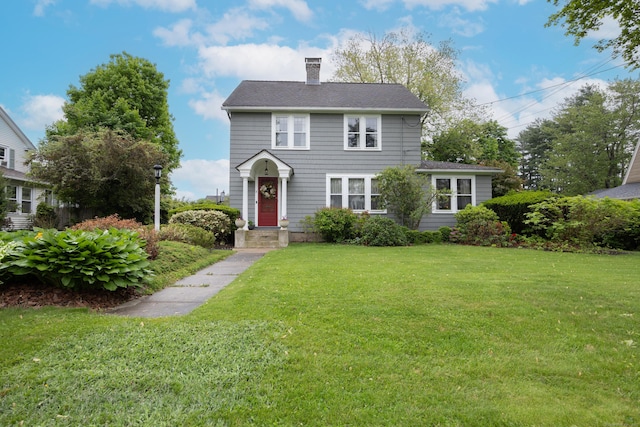 8 Usher Ave, Plainville, CT 06062 - view of front of home with a chimney and a front yard