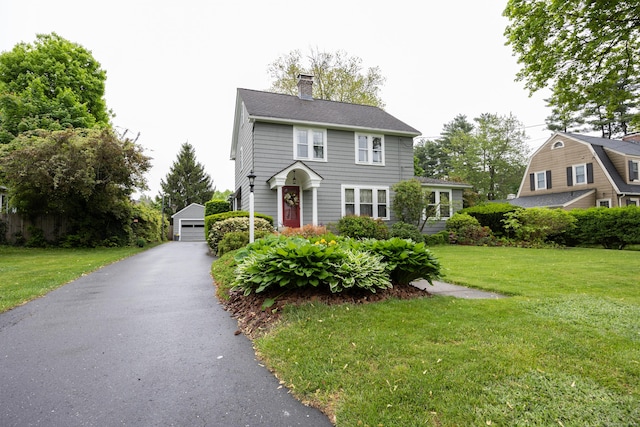 8 Usher Ave, Plainville, CT 06062 - colonial inspired home with an outbuilding, a garage, a chimney, and a front yard