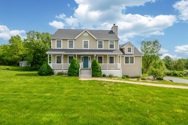94 Ridge Rd, Plymouth, CT 06786 - colonial-style house with a chimney, covered porch, a front lawn, and roof with shingles