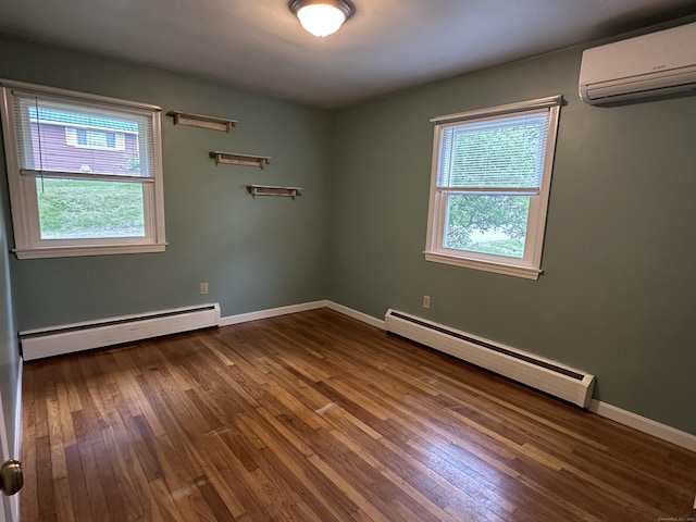 331 Pond Hill Rd, Plainfield, CT 06354 - empty room with a wall mounted AC, a baseboard heating unit, baseboard heating, hardwood / wood-style flooring, and baseboards