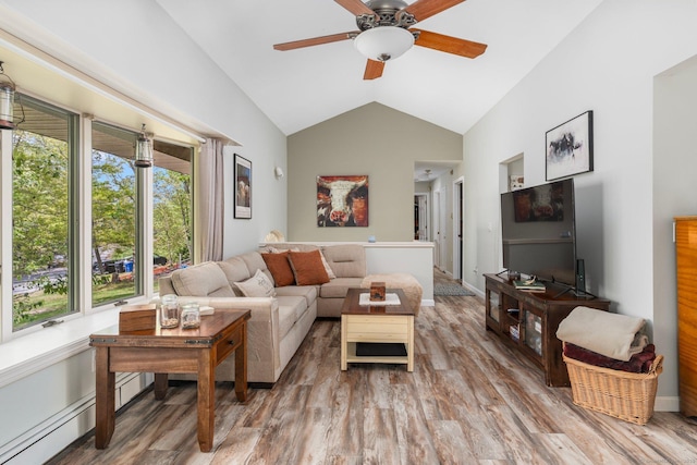 232 Bailey Hill Rd, Killingly, CT 06239 - living room with wood finished floors, vaulted ceiling, ceiling fan, and baseboards