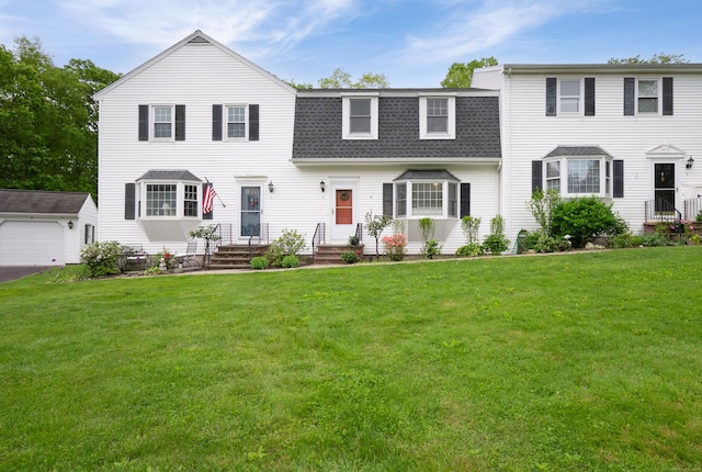 5 Bridgewater Cmn Unit 5, Bridgewater, CT 06752 - view of front of home with roof with shingles, an outdoor structure, a front lawn, and a garage