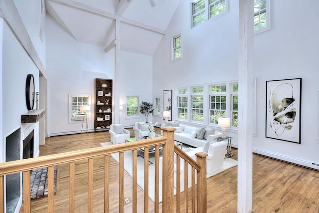 481 Ridgefield Rd, Wilton, CT 06897 - living room featuring high vaulted ceiling, light wood-style floors, and baseboard heating