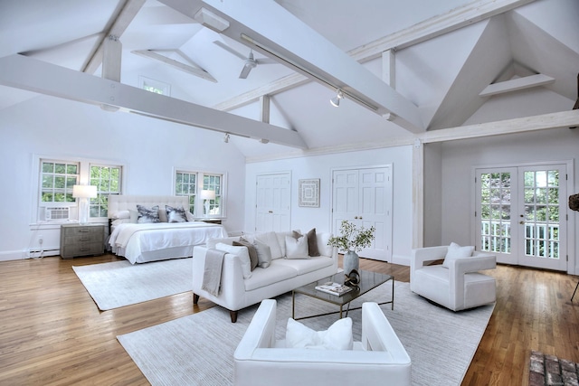 481 Ridgefield Rd, Wilton, CT 06897 - bedroom featuring high vaulted ceiling, two closets, beam ceiling, baseboard heating, and wood finished floors