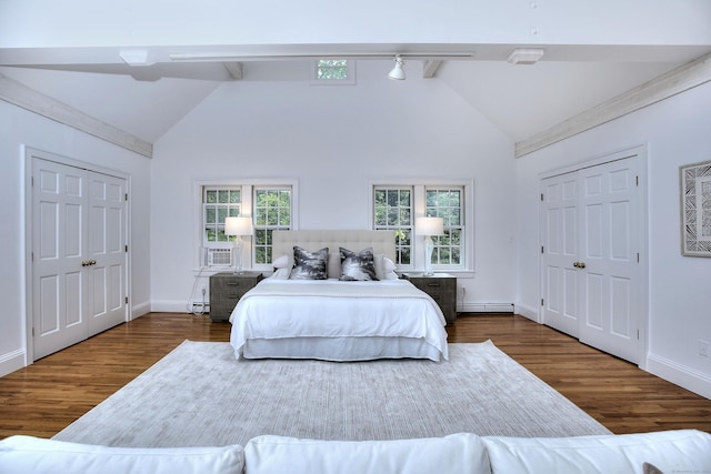 481 Ridgefield Rd, Wilton, CT 06897 - bedroom featuring wood finished floors, a baseboard heating unit, baseboards, baseboard heating, and rail lighting