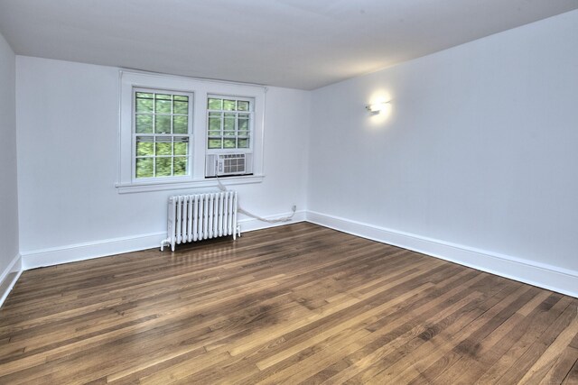 481 Ridgefield Rd, Wilton, CT 06897 - unfurnished room with radiator heating unit, dark wood-style floors, and baseboards