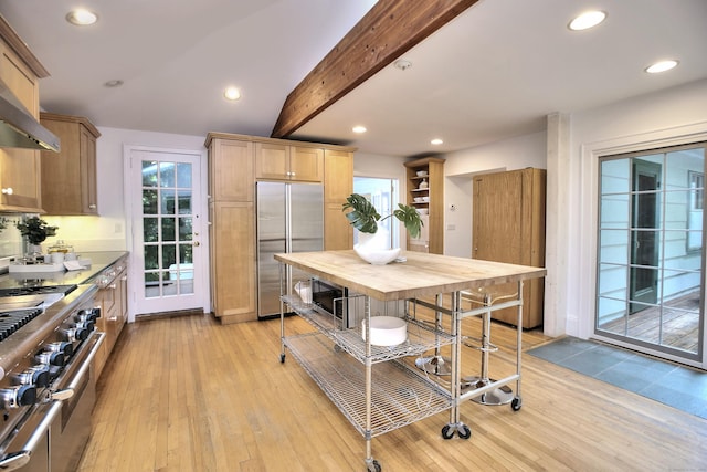 481 Ridgefield Rd, Wilton, CT 06897 - kitchen with high quality appliances, light wood-type flooring, beam ceiling, wall chimney exhaust hood, and recessed lighting