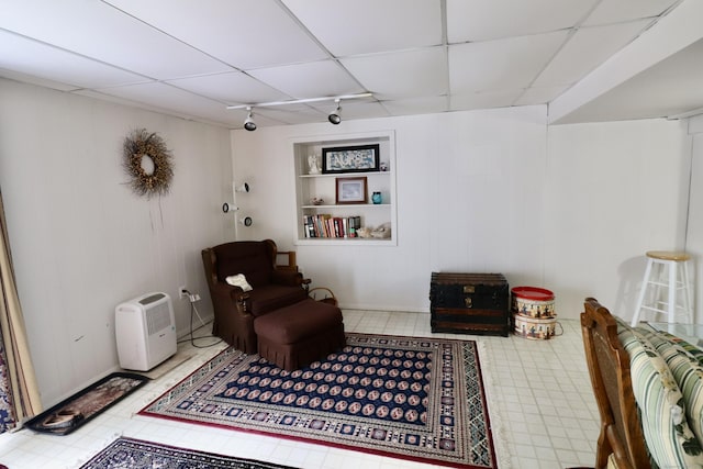 880 Long Hill Rd Unit 880, Middletown, CT 06457 - living area with a paneled ceiling, rail lighting, baseboards, and tile patterned floors