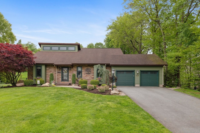23 Blackhaw Dr, Cromwell, CT 06416 - mid-century inspired home featuring a garage, asphalt driveway, a front yard, and roof with shingles