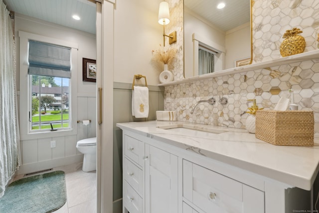 23 Blackhaw Dr, Cromwell, CT 06416 - bathroom with a decorative wall, vanity, recessed lighting, toilet, and tasteful backsplash