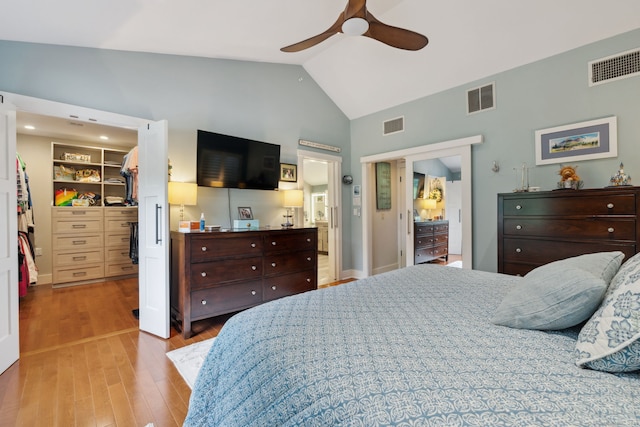 23 Blackhaw Dr, Cromwell, CT 06416 - bedroom featuring a walk in closet, wood finished floors, a closet, high vaulted ceiling, and a ceiling fan