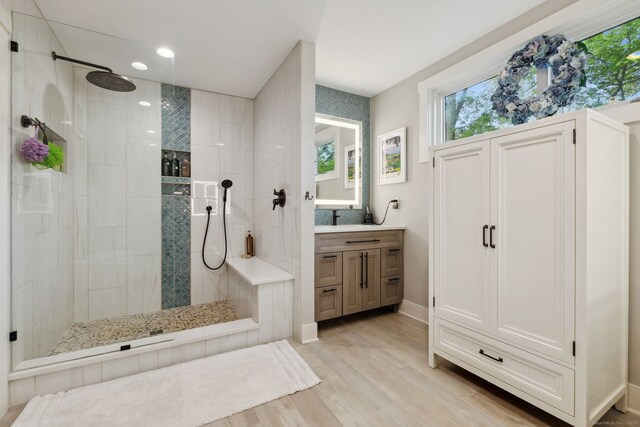 23 Blackhaw Dr, Cromwell, CT 06416 - bathroom featuring wood finished floors, walk in shower, vanity, recessed lighting, and baseboards