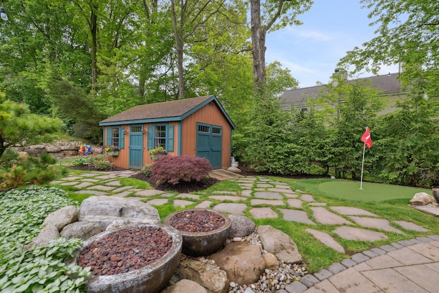 23 Blackhaw Dr, Cromwell, CT 06416 - view of yard with a putting green and an outdoor structure