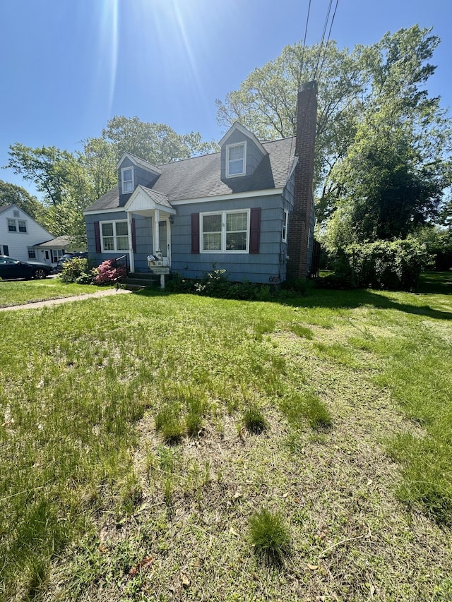 710 Middle Tpke W, Manchester, CT 06040 - view of front of house featuring a chimney and a front lawn