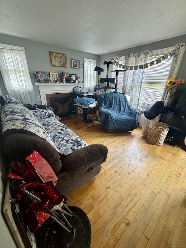 710 Middle Tpke W, Manchester, CT 06040 - living room with plenty of natural light, wood-type flooring, and a brick fireplace