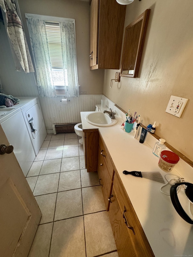 710 Middle Tpke W, Manchester, CT 06040 - bathroom with washing machine and clothes dryer, toilet, vanity, tile patterned floors, and a wainscoted wall