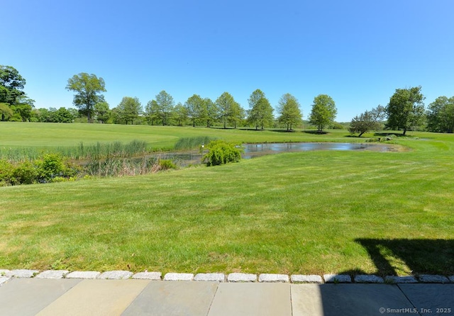 419 Heritage Vlg Unit B, Southbury, CT 06488 - view of grassy yard featuring a water view