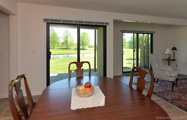 419 Heritage Vlg Unit B, Southbury, CT 06488 - dining room featuring baseboards