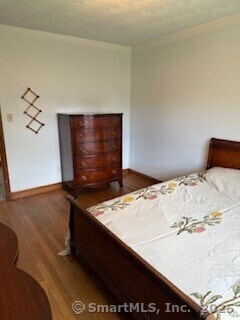153 Barton St, Torrington, CT 06790 - bedroom with wood finished floors and baseboards