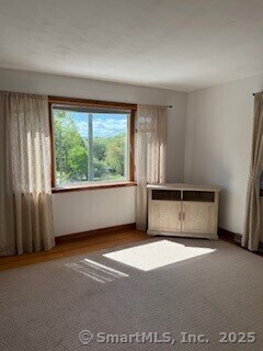153 Barton St, Torrington, CT 06790 - empty room with baseboards and wood finished floors