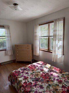 153 Barton St, Torrington, CT 06790 - bedroom featuring multiple windows and wood finished floors