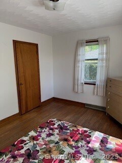 153 Barton St, Torrington, CT 06790 - unfurnished bedroom featuring wood finished floors and baseboards