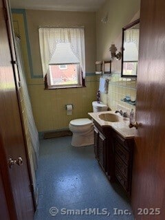 153 Barton St, Torrington, CT 06790 - bathroom featuring healthy amount of natural light, a wainscoted wall, vanity, and toilet