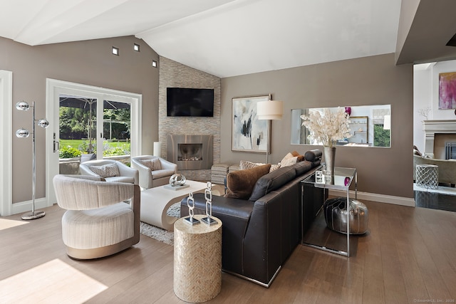 166 Long Lots Rd, Westport, CT 06880 - living room with a fireplace, wood finished floors, and vaulted ceiling