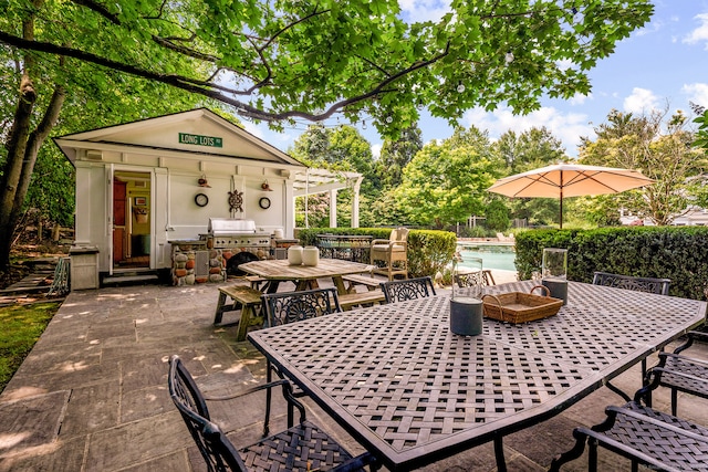 166 Long Lots Rd, Westport, CT 06880 - view of patio featuring outdoor dining area, an outdoor pool, an outbuilding, and an outdoor kitchen