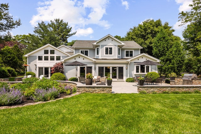166 Long Lots Rd, Westport, CT 06880 - back of house with a yard, a patio area, a shingled roof, and an outdoor living space