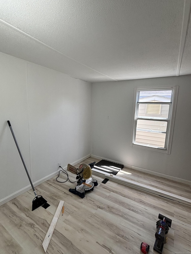 1012 Old Colony Rd Lot 85, Meriden, CT 06451 - unfurnished room featuring wood finished floors, a textured ceiling, and baseboards