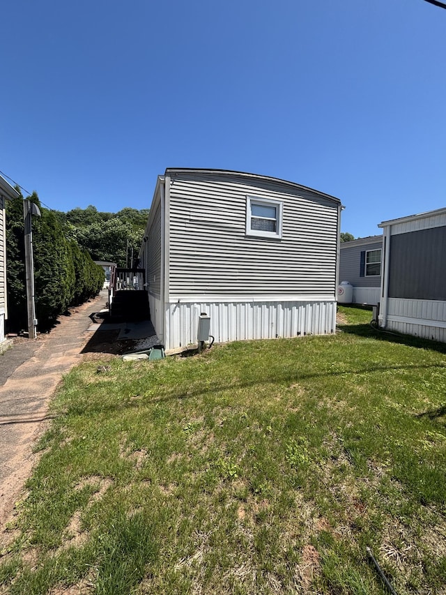 1012 Old Colony Rd Lot 85, Meriden, CT 06451 - view of home's exterior with a lawn